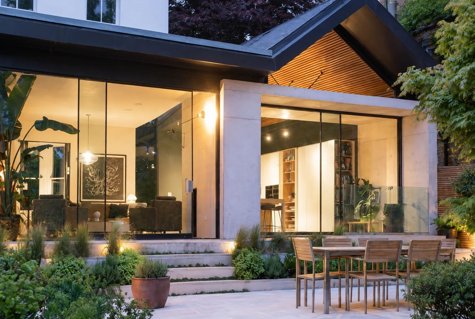 Close view of sliding glass doors in a contemporary extension overlooking a landscaped terrace