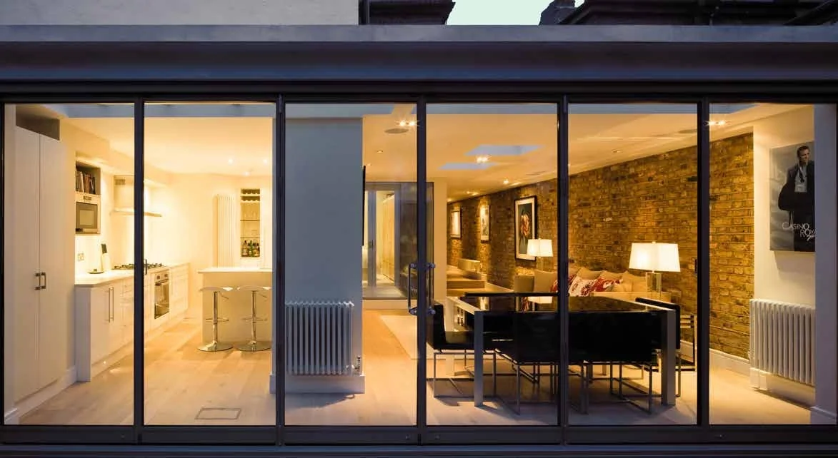 A close exterior view of slender sliding door profiles